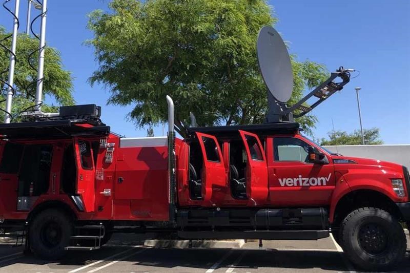 Red Verizon branded THOR vehicle with satellite